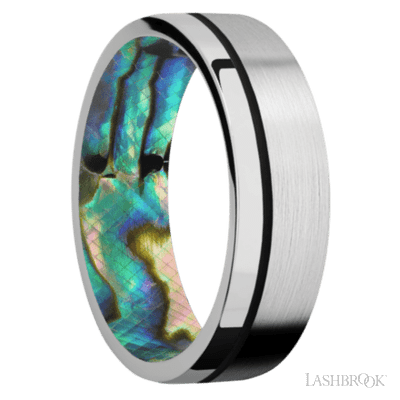7 mm wide/Flat/14K White Gold band with one 0.5 mm Off Center inlay of Black also featuring a Abalone sleeve.