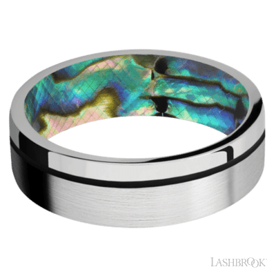 7 mm wide/Flat/14K White Gold band with one 0.5 mm Off Center inlay of Black also featuring a Abalone sleeve.
