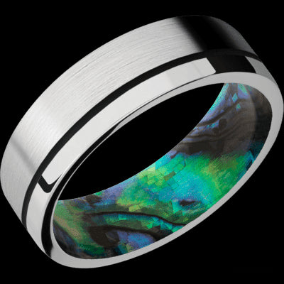 7 mm wide/Flat/14K White Gold band with one 0.5 mm Off Center inlay of Black also featuring a Abalone sleeve.