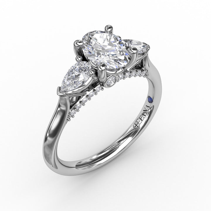 Classic Oval Three-Stone Diamond Engagement Ring With Pear-Shape Side Diamonds