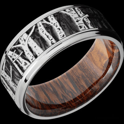9 mm wide/Flat Grooved Edges/Cobalt Chrome band with a laser carved Aspen pattern also featuring a Leopard Wood sleeve.