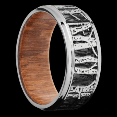 9 mm wide/Flat Grooved Edges/Cobalt Chrome band with a laser carved Aspen pattern also featuring a Leopard Wood sleeve.