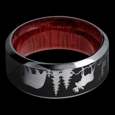 9 mm wide/High Bevel/Tantalum band with a laser carved Bear Moose Deer Mountain pattern also featuring a Blood Wood sleeve.