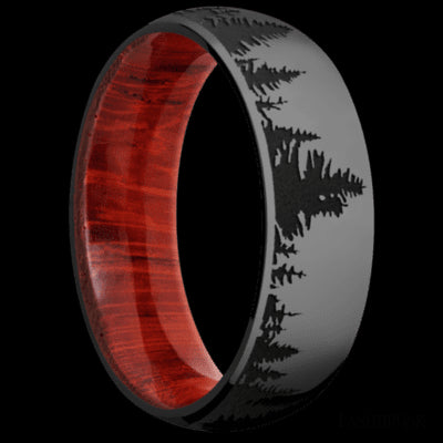 7 mm wide/Domed/Zirconium band with a laser carved Trees pattern also featuring a Padauk sleeve.