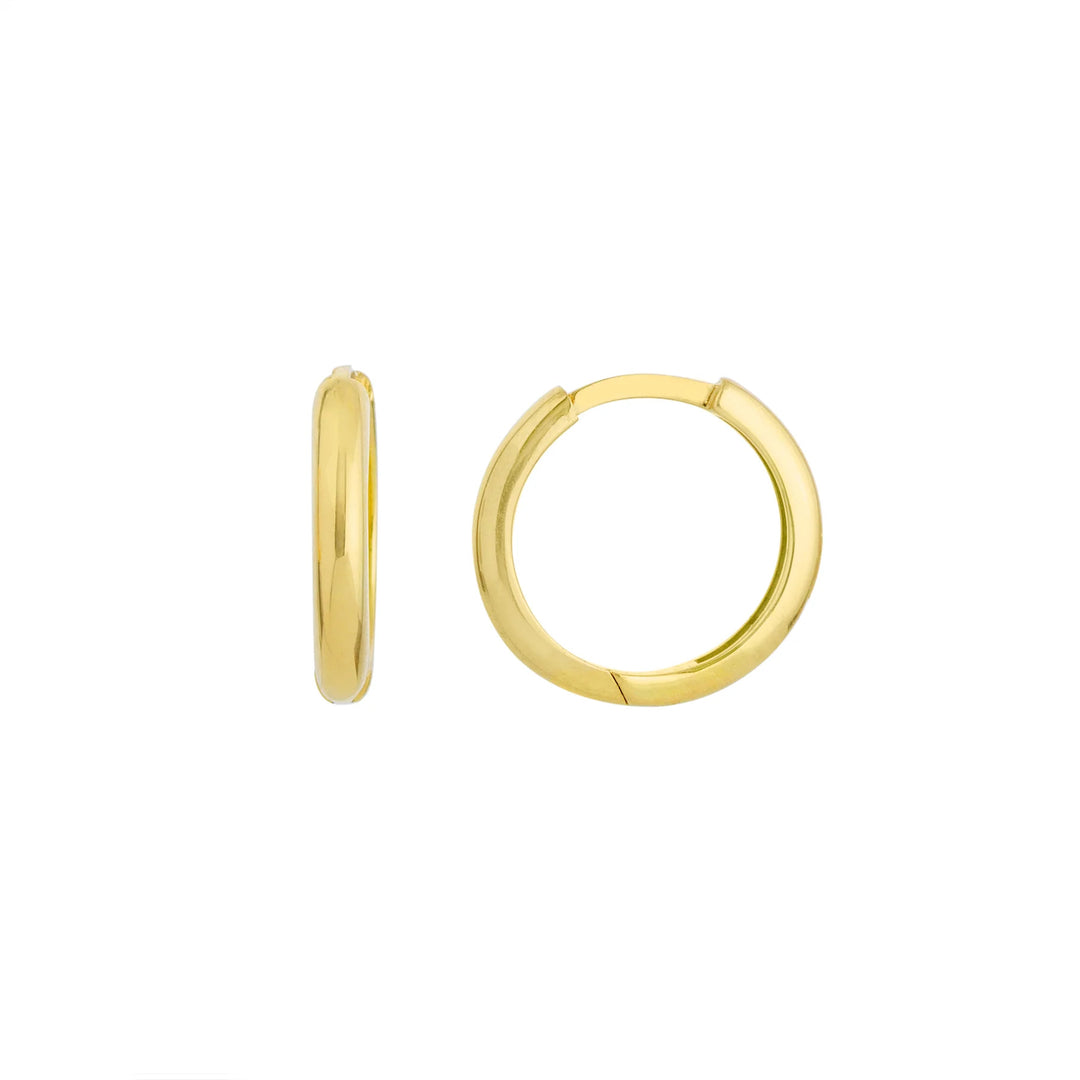 Gold hoop earrings on a white background