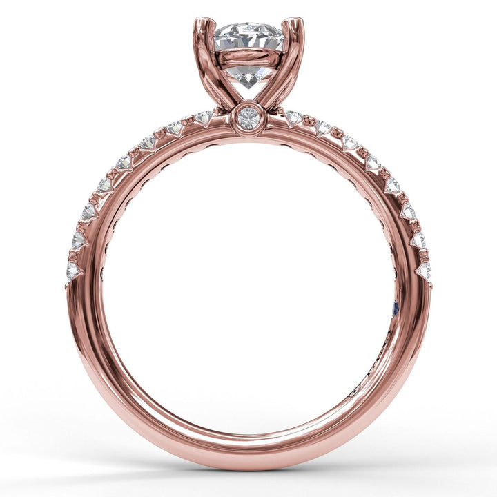 Classic Single Row Engagement ring with an Oval Center Diamond.