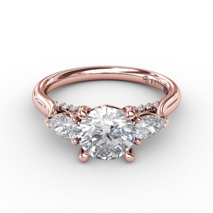 Classic Three-Stone Diamond Engagement Ring With Pear-Shape Side Diamonds