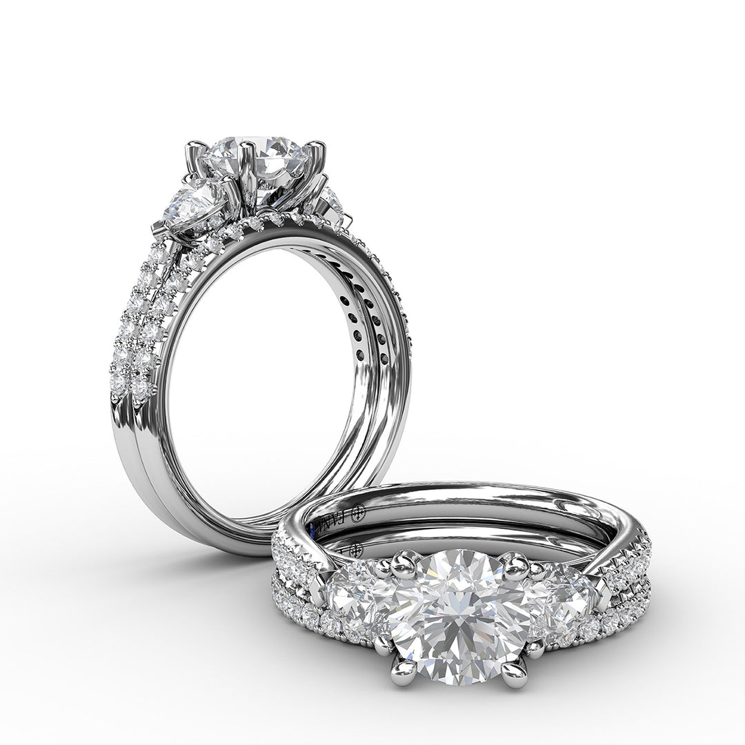 Elegant Pear Sidestone Ring in Sapphire