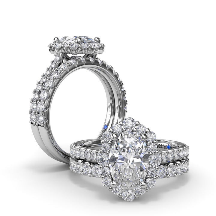 Oval Diamond Graduated Halo Engagement Ring